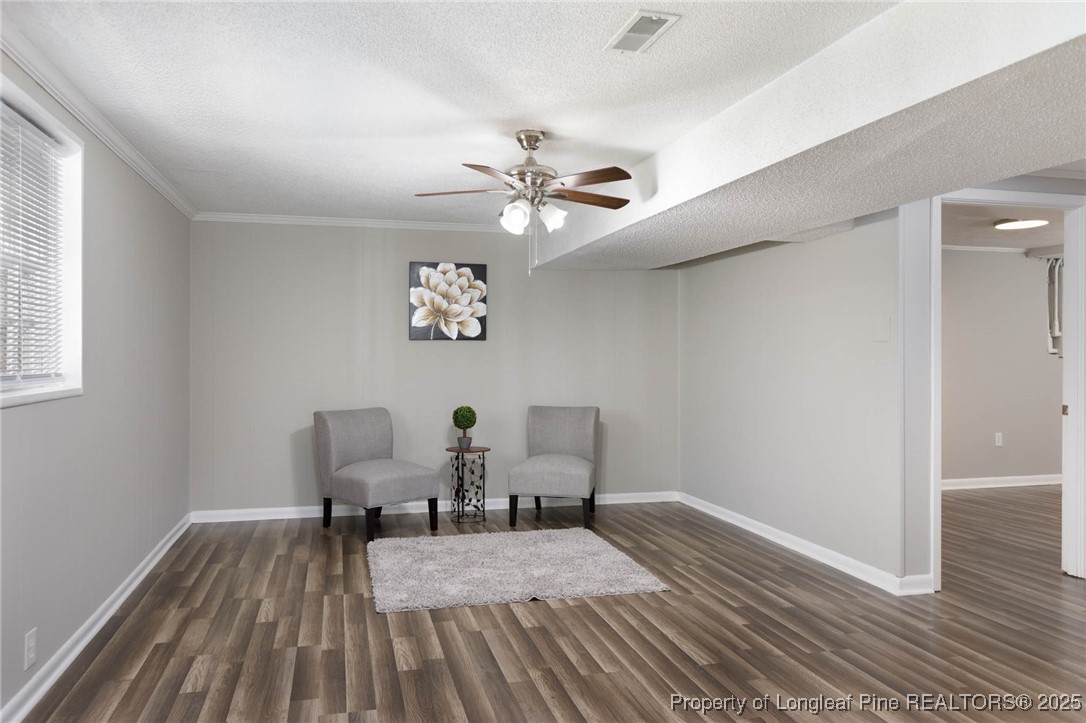 2419 Morganton Road Fayetteville, NC 28303 - Photo 35 of 44 a bedroom with a bed and a chandelier