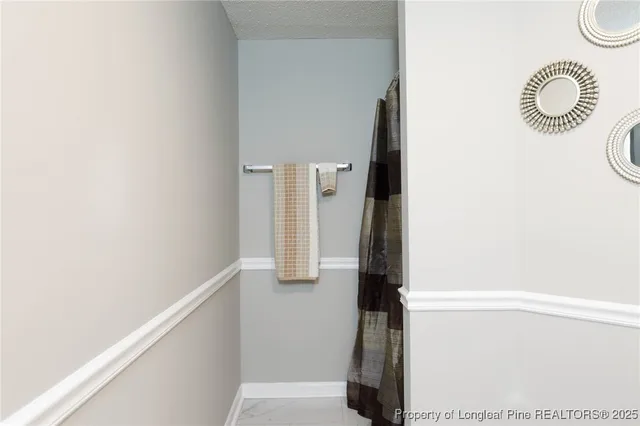 a view of a swimming pool with a patio and yard