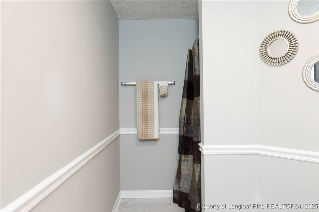 2419 Morganton Road Fayetteville, NC 28303 - Photo 40 of 44 a view of front door and utility room