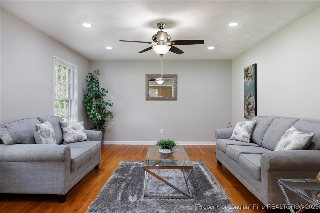 2419 Morganton Road Fayetteville, NC 28303 - Photo 5 of 44 a living room with furniture and a chandelier