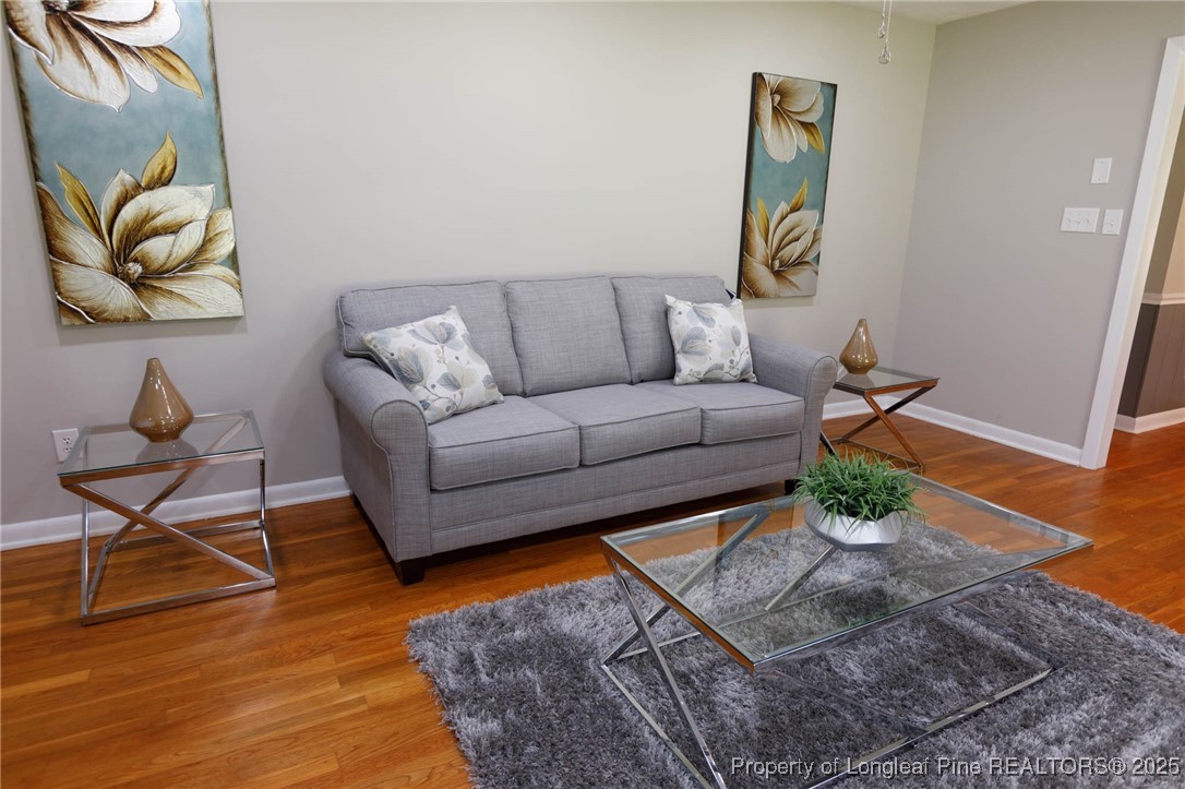 2419 Morganton Road Fayetteville, NC 28303 - Photo 6 of 44 a living room with furniture and a wooden floor