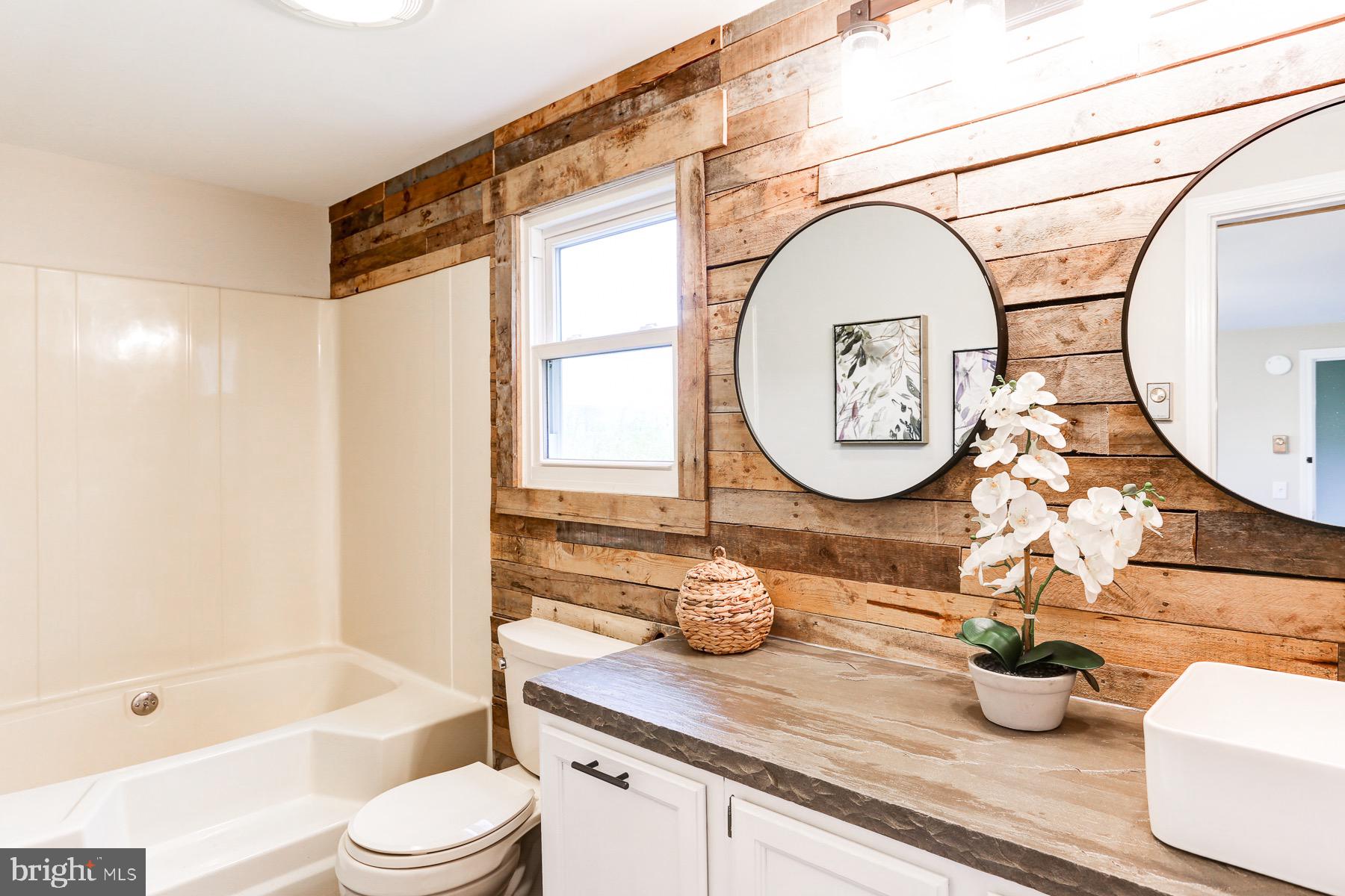3817 Elizabethtown Road Manheim, PA 17545 - Photo 24 of 70 a bathroom with a toilet a sink and a mirror