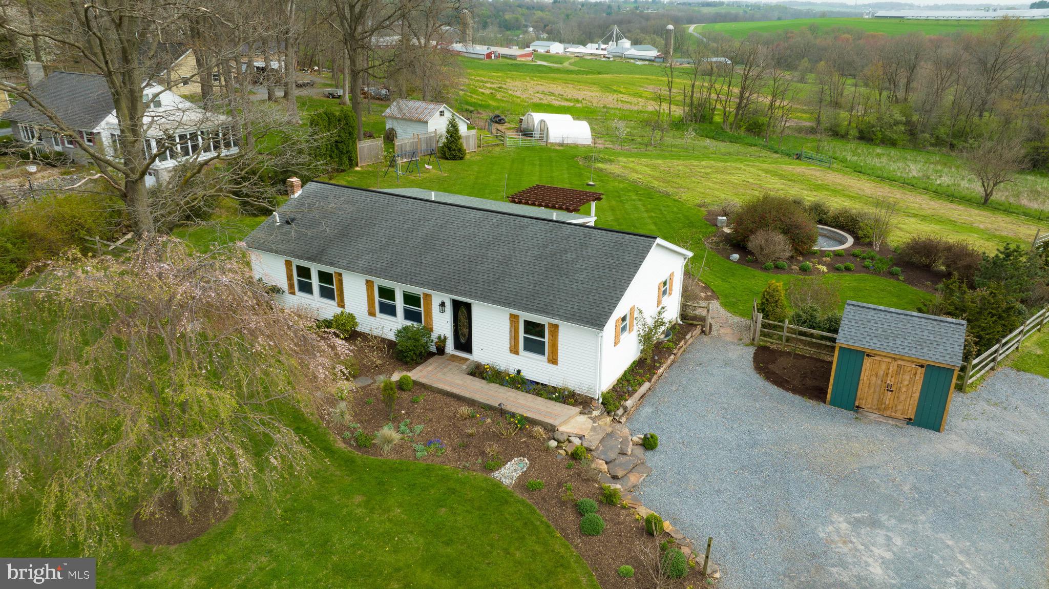 3817 Elizabethtown Road Manheim, PA 17545 - Photo 51 of 70 a aerial view of a house with a yard table and chairs