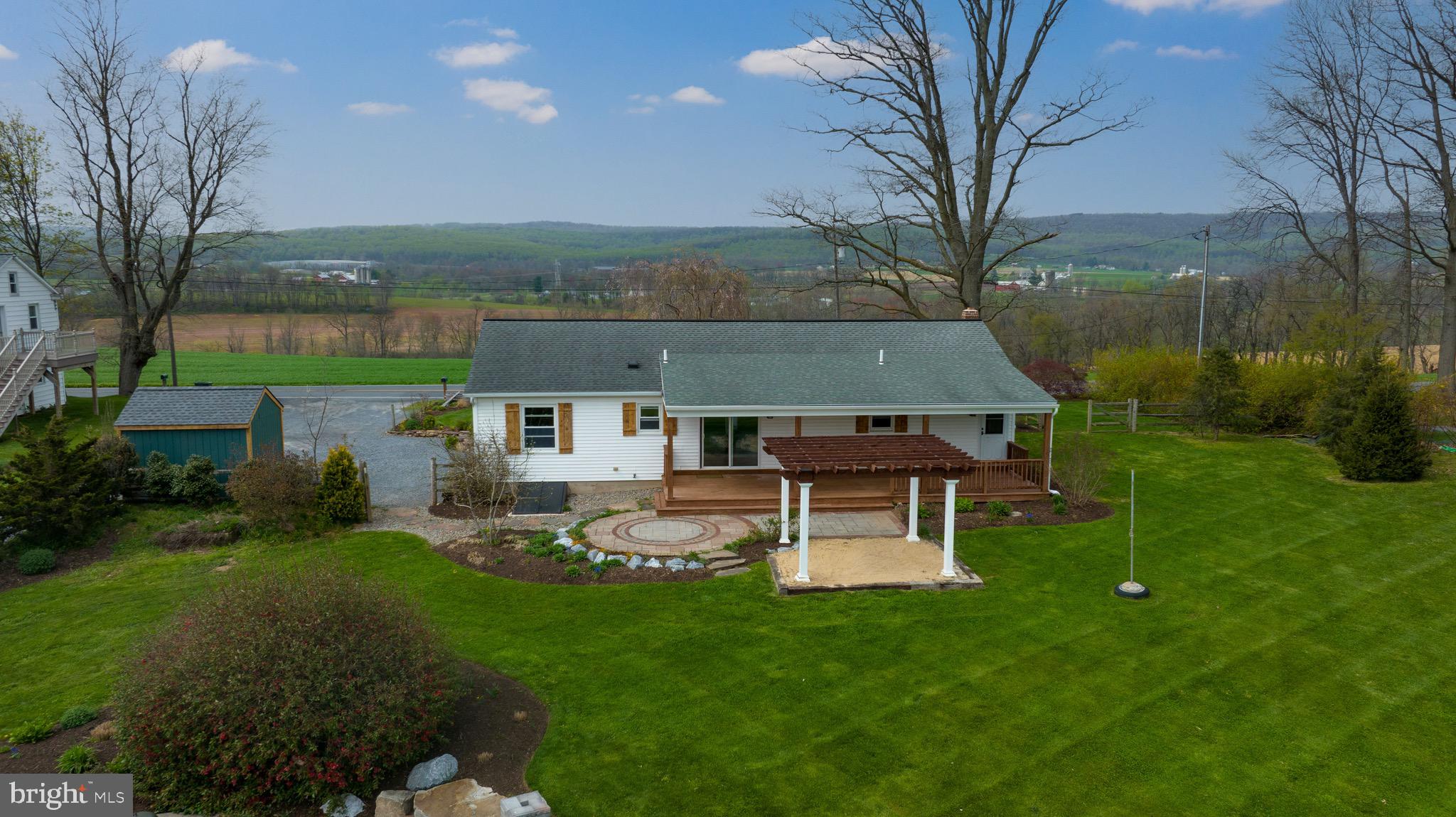 3817 Elizabethtown Road Manheim, PA 17545 - Photo 54 of 70 a view of a house with a yard porch and sitting area