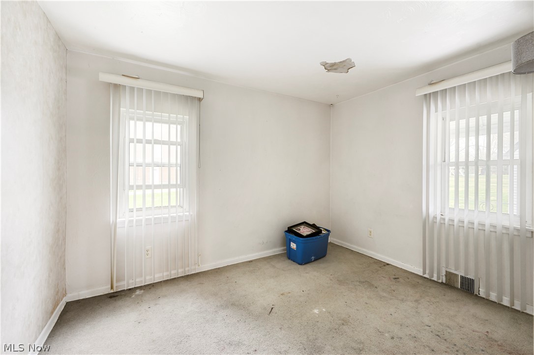 4001 South Cleveland Massillon Road Barberton, OH 44203 - Photo 21 of 25 Carpeted spare room featuring baseboards