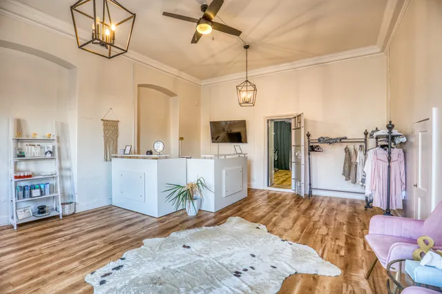 a bedroom with a bed dresser and a flat screen tv