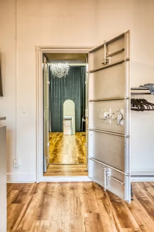a view of walk in closet with empty racks