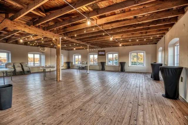 a view of a hall with wooden floor