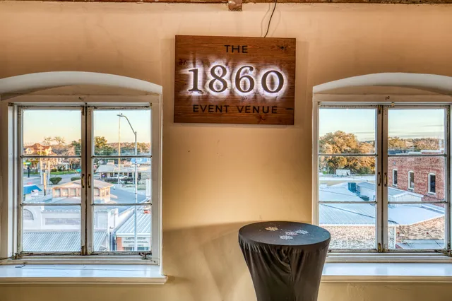 a view of a door and car parked from a window