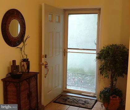 11286 Harbor Court, Unit 11286 Reston, VA 20191 - Photo 18 of 27 a bathroom with a granite countertop sink and a mirror