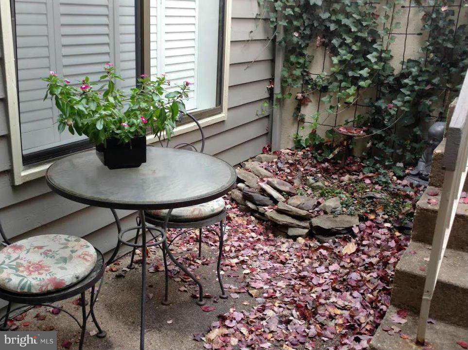11286 Harbor Court, Unit 11286 Reston, VA 20191 - Photo 21 of 27 a view of a chairs and table in a patio