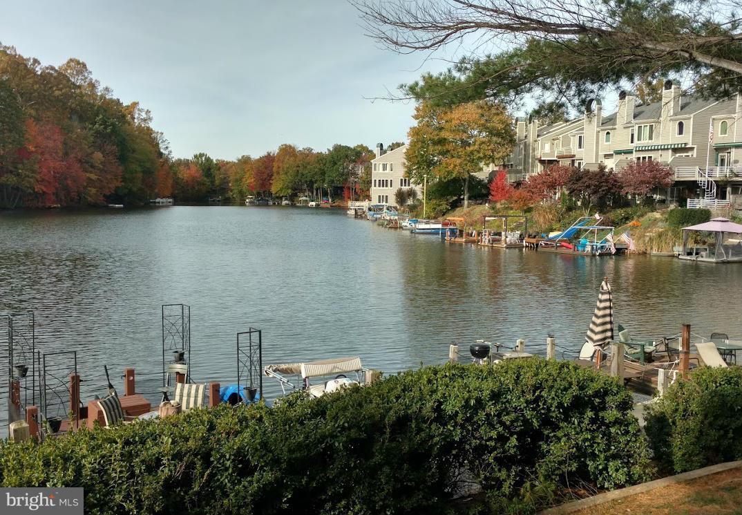 11286 Harbor Court, Unit 11286 Reston, VA 20191 - Photo 25 of 27 a view of a lake with houses