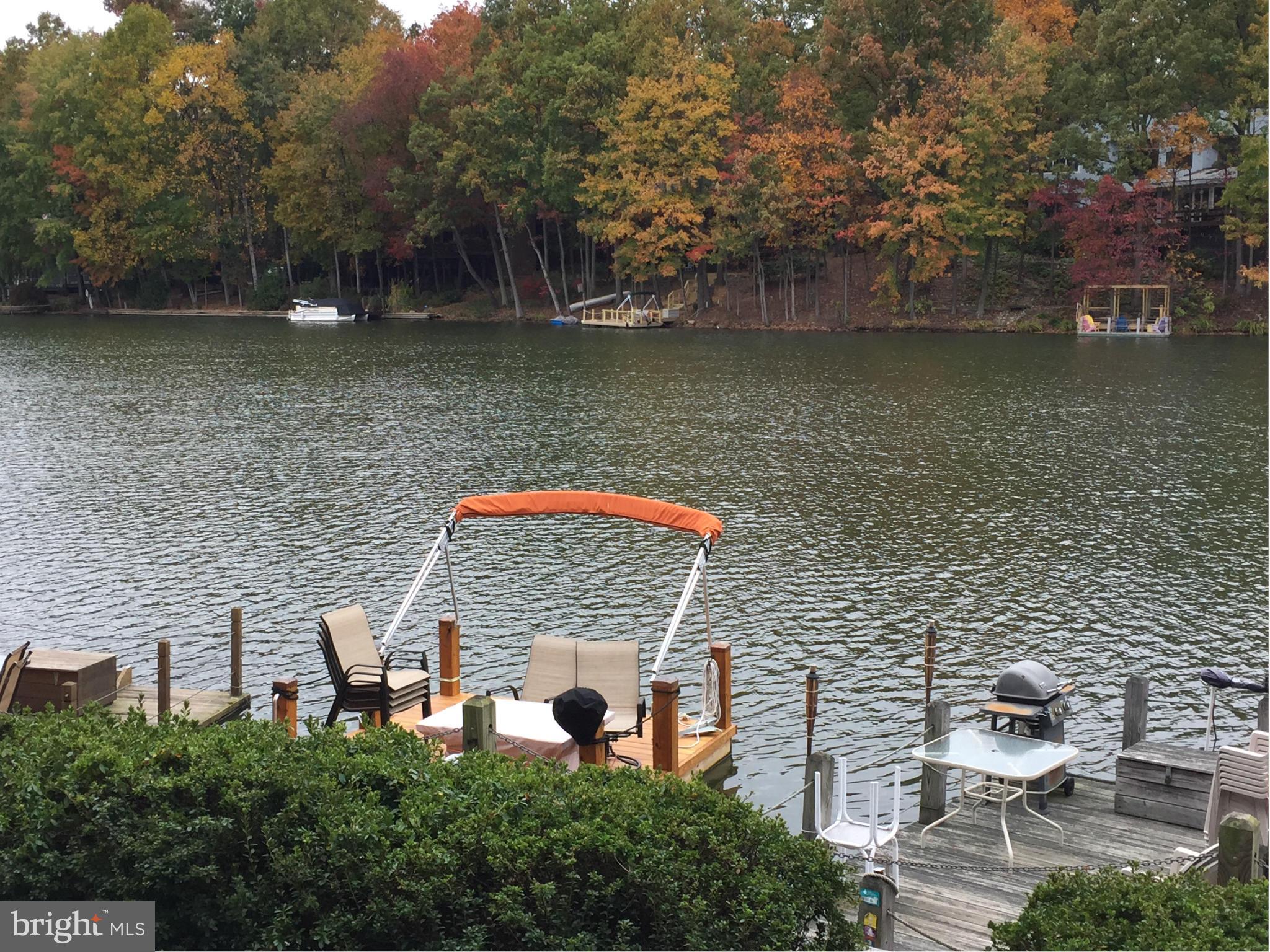 11286 Harbor Court, Unit 11286 Reston, VA 20191 - Photo 5 of 27 an aerial view of a house with a lake view