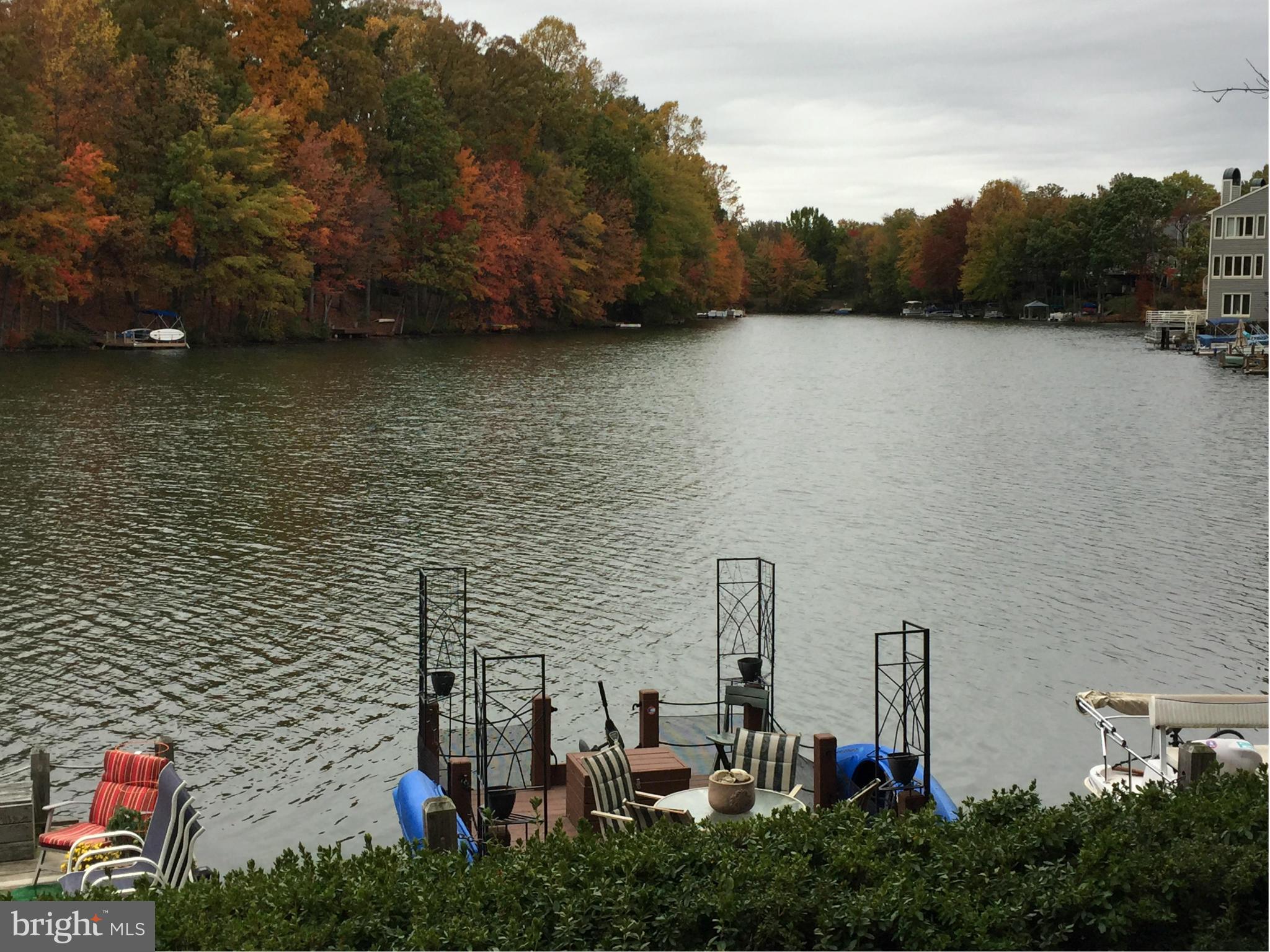 11286 Harbor Court, Unit 11286 Reston, VA 20191 - Photo 7 of 27 a view of a lake with a mountain in the background