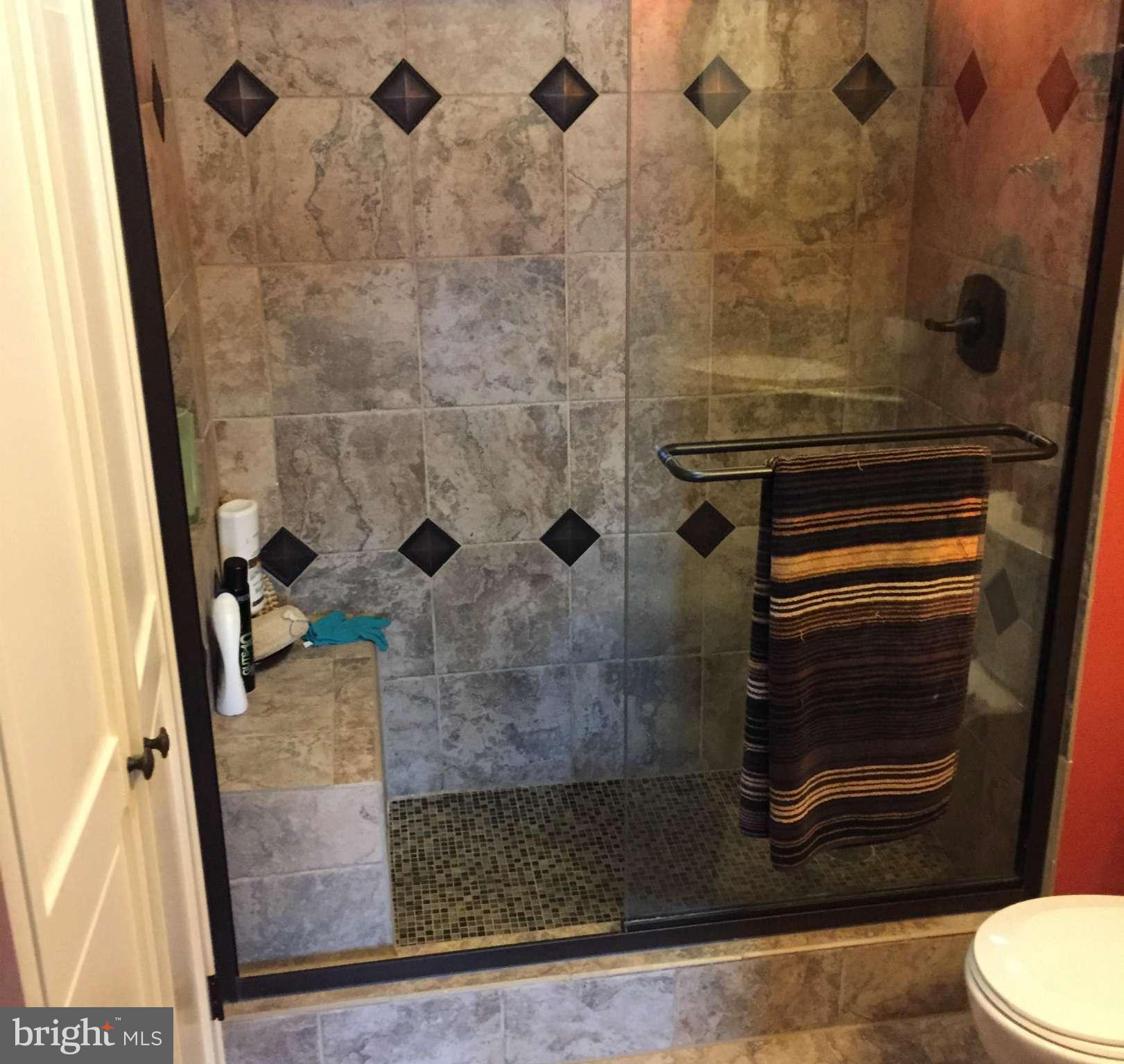 11286 Harbor Court, Unit 11286 Reston, VA 20191 - Photo 9 of 27 a bathroom with a granite countertop shower