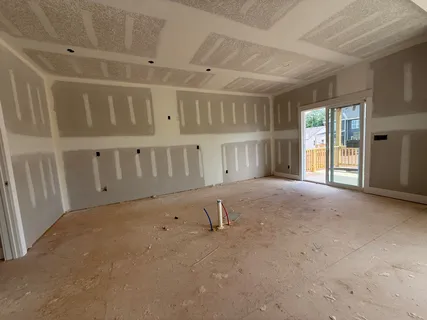 a view of an empty room with windows