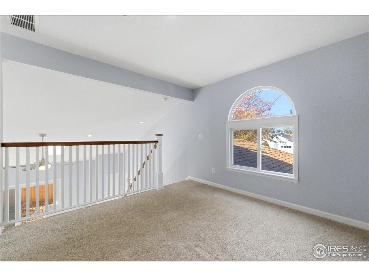 1812 Rice Street Longmont, CO 80501 - Photo 25 of 44 a view of an empty room with a window