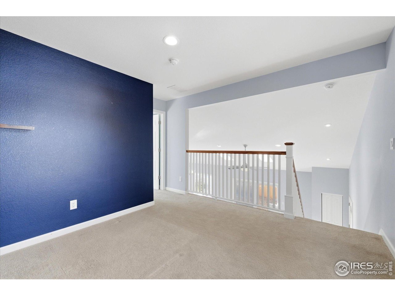 1812 Rice Street Longmont, CO 80501 - Photo 27 of 44 a view of a livingroom with a staircase