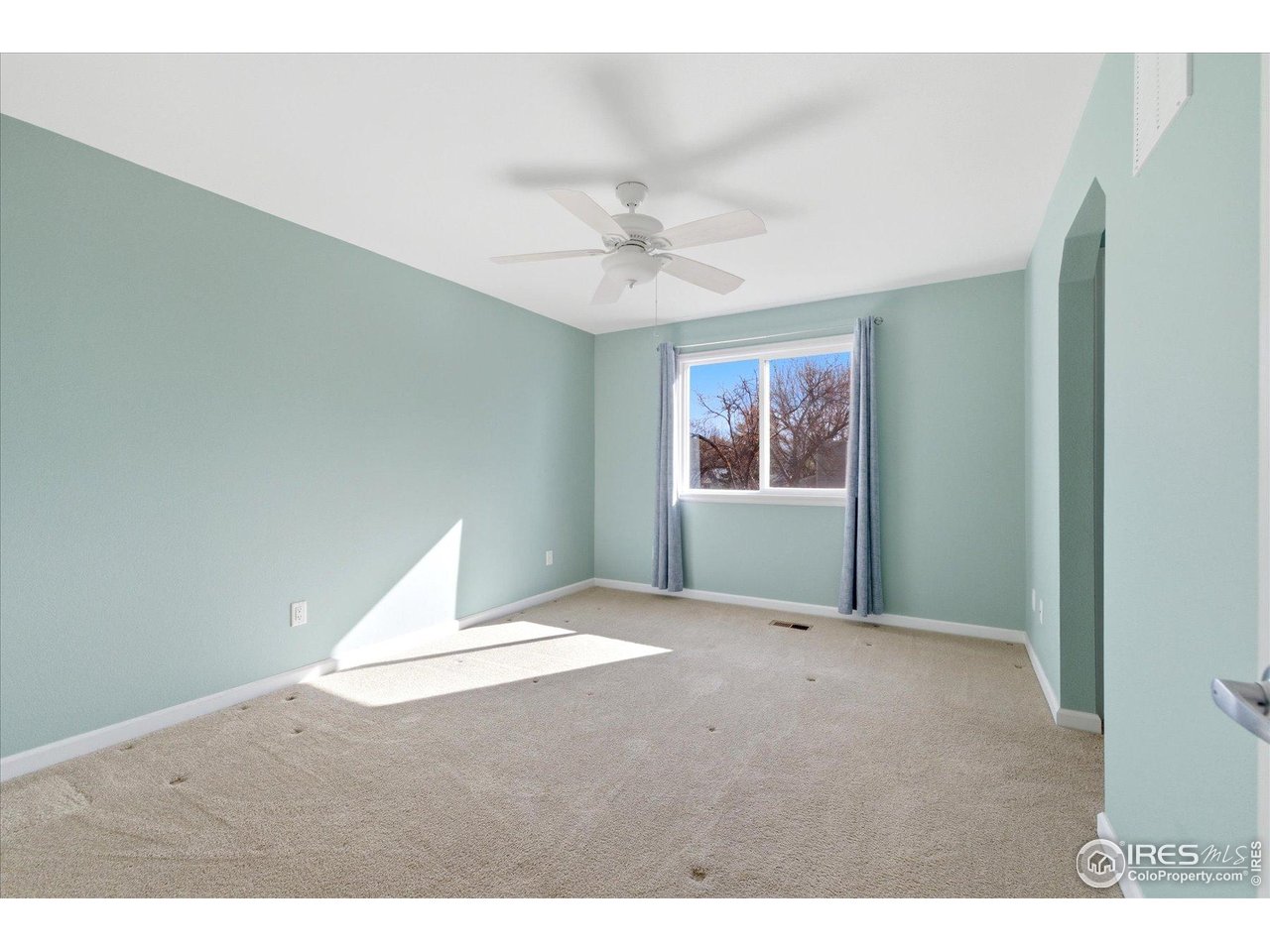1812 Rice Street Longmont, CO 80501 - Photo 31 of 44 a view of an empty room with a window