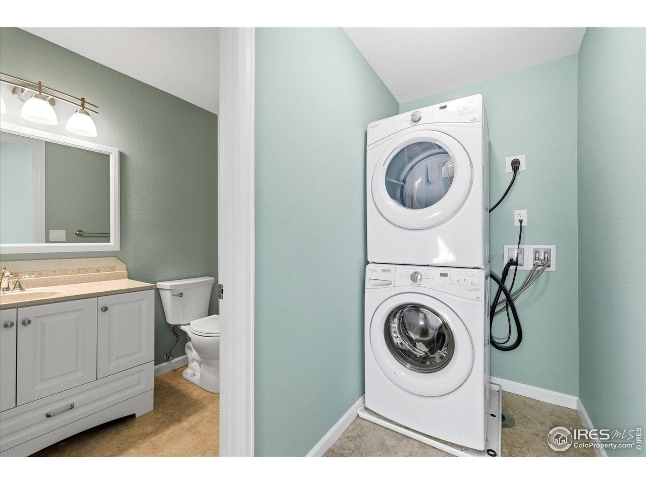 1812 Rice Street Longmont, CO 80501 - Photo 34 of 44 a utility room with dryer and washer