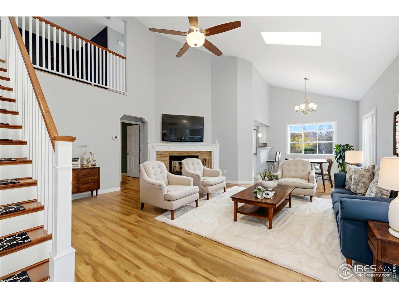 1812 Rice Street Longmont, CO 80501 - Photo 4 of 44 a living room with furniture or couch and a wooden floor