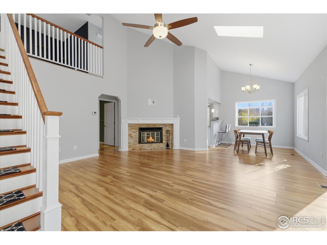 1812 Rice Street Longmont, CO 80501 - Photo 5 of 44 an empty room with wooden floor and windows