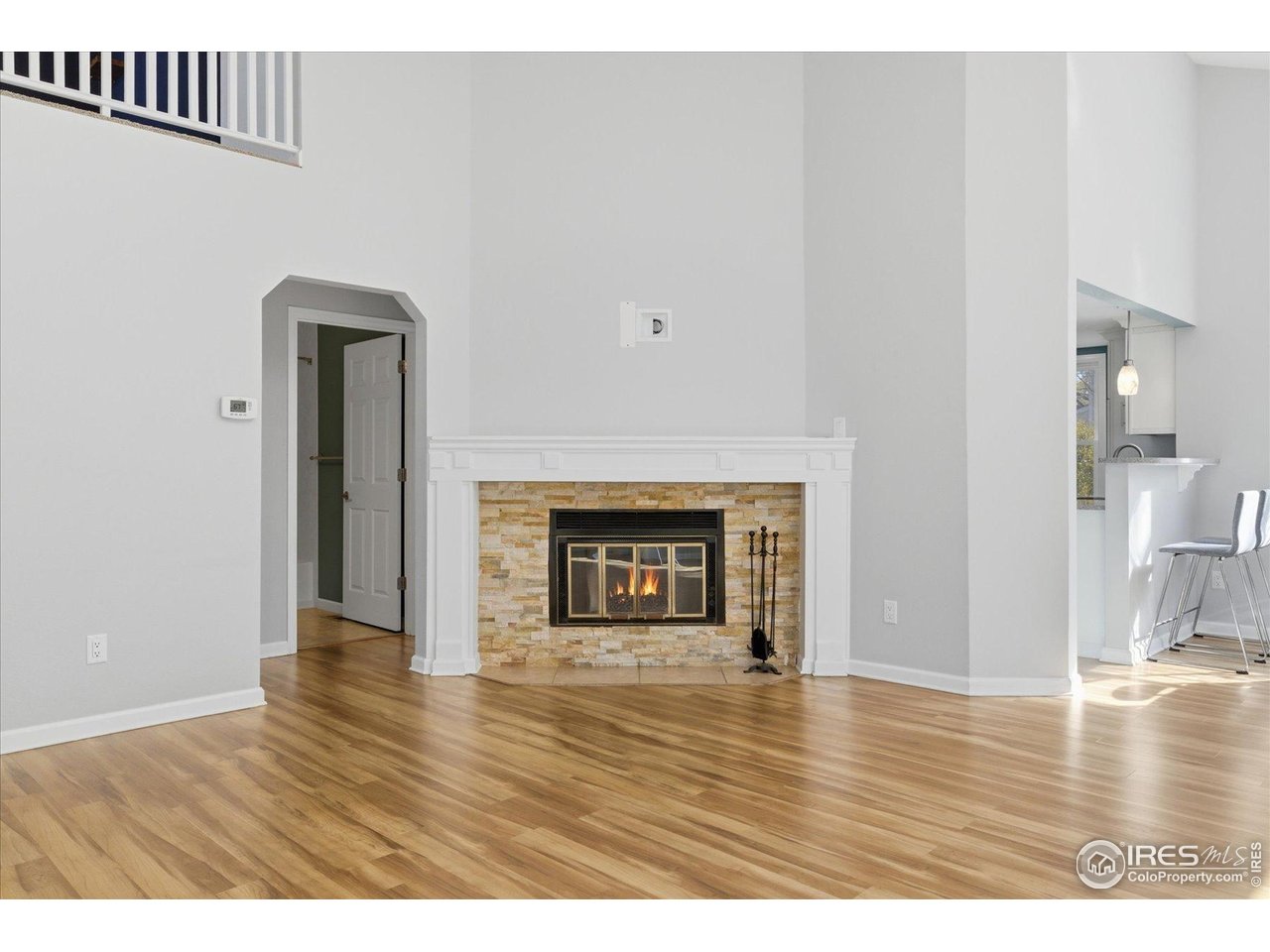 1812 Rice Street Longmont, CO 80501 - Photo 9 of 44 a view of an empty room and wooden floor
