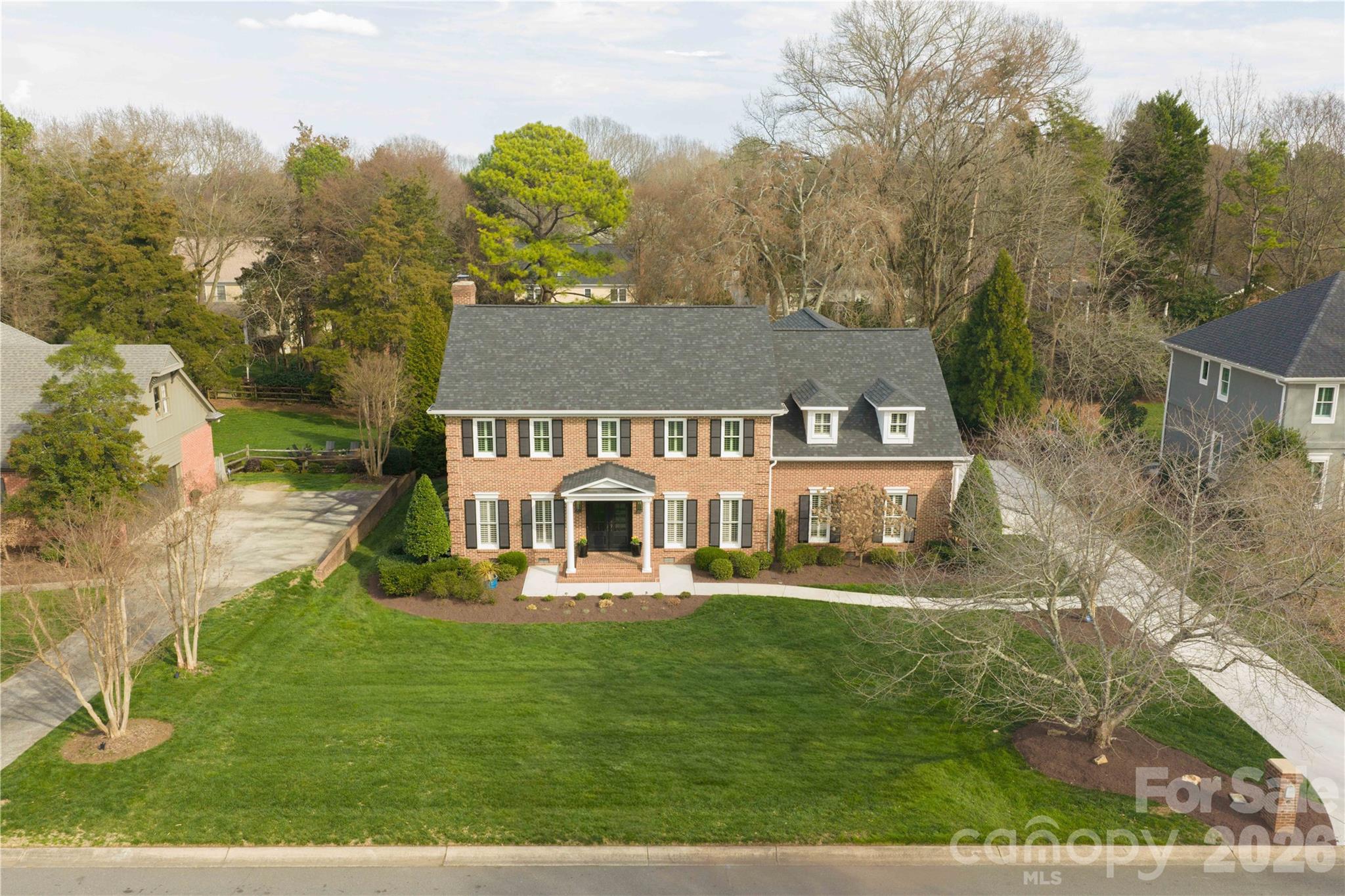 an aerial view of a house with a garden