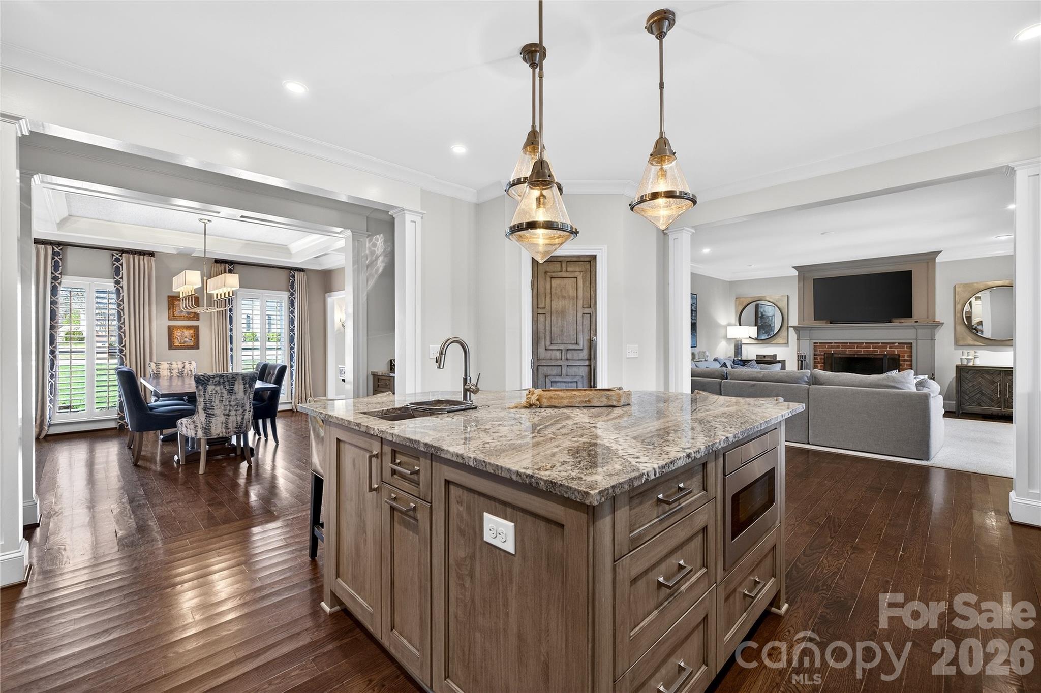 3025 Foxridge Road Charlotte, NC 28226 - Photo 13 of 48 a kitchen with a stove a counter top space and wooden floor