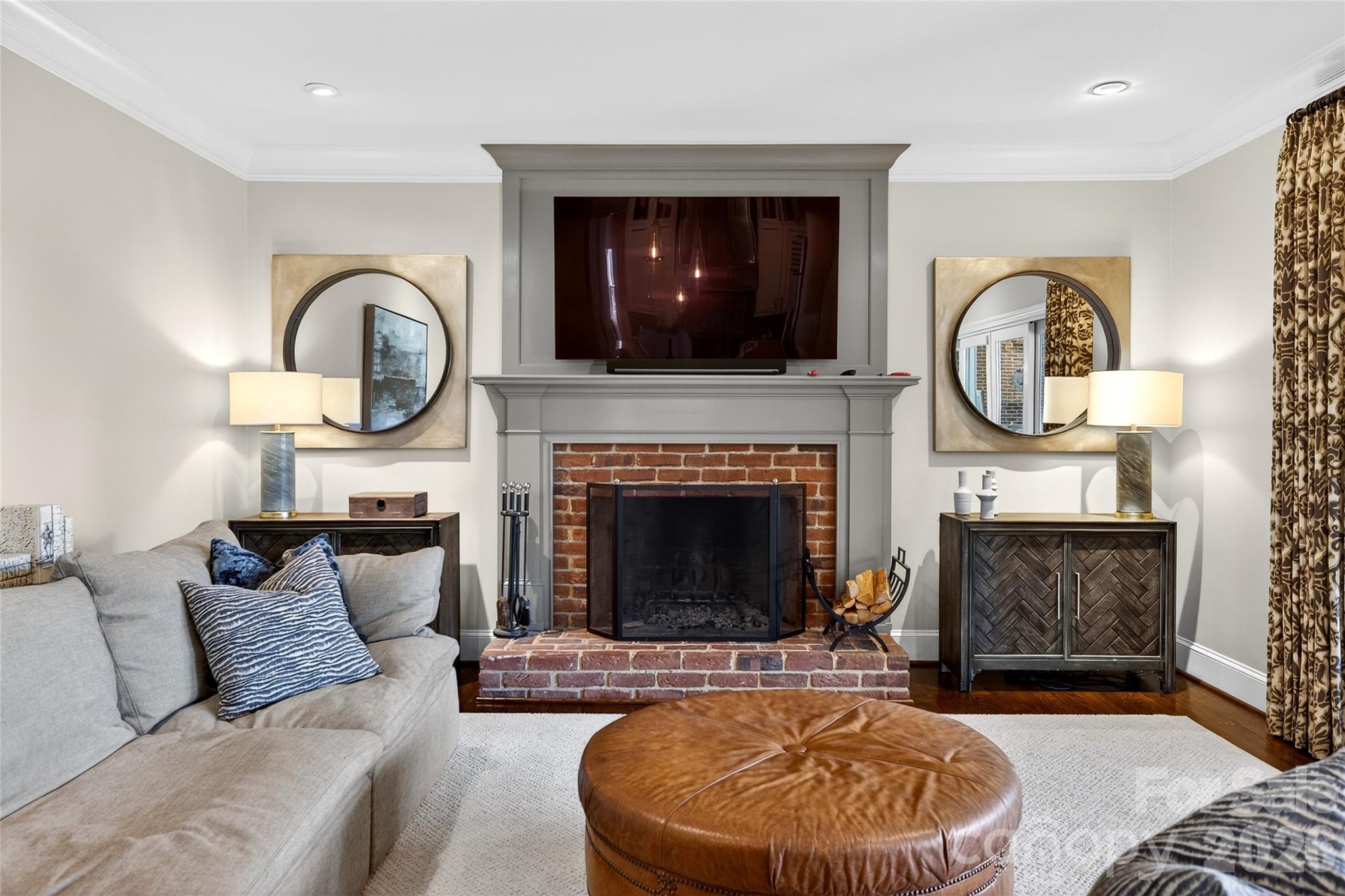 3025 Foxridge Road Charlotte, NC 28226 - Photo 17 of 48 a living room with furniture and a fireplace