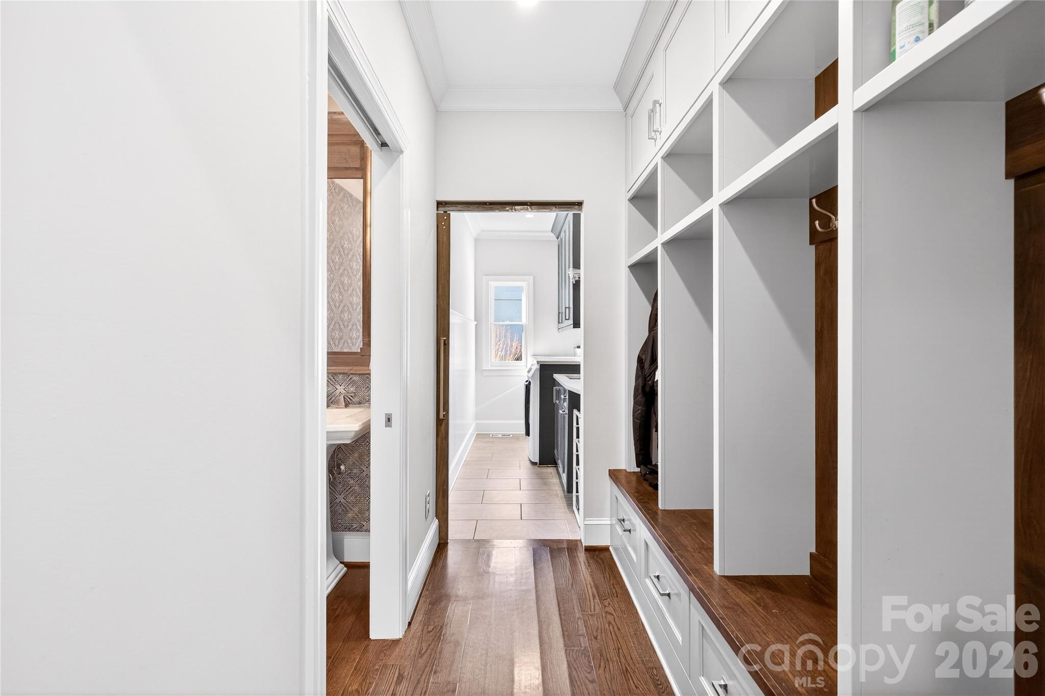3025 Foxridge Road Charlotte, NC 28226 - Photo 20 of 48 a view of a hallway with wooden floor and staircase