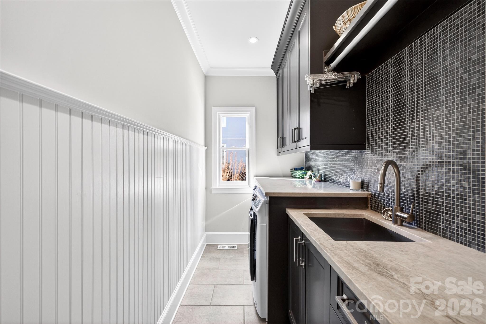 3025 Foxridge Road Charlotte, NC 28226 - Photo 21 of 48 a kitchen with a sink and a refrigerator