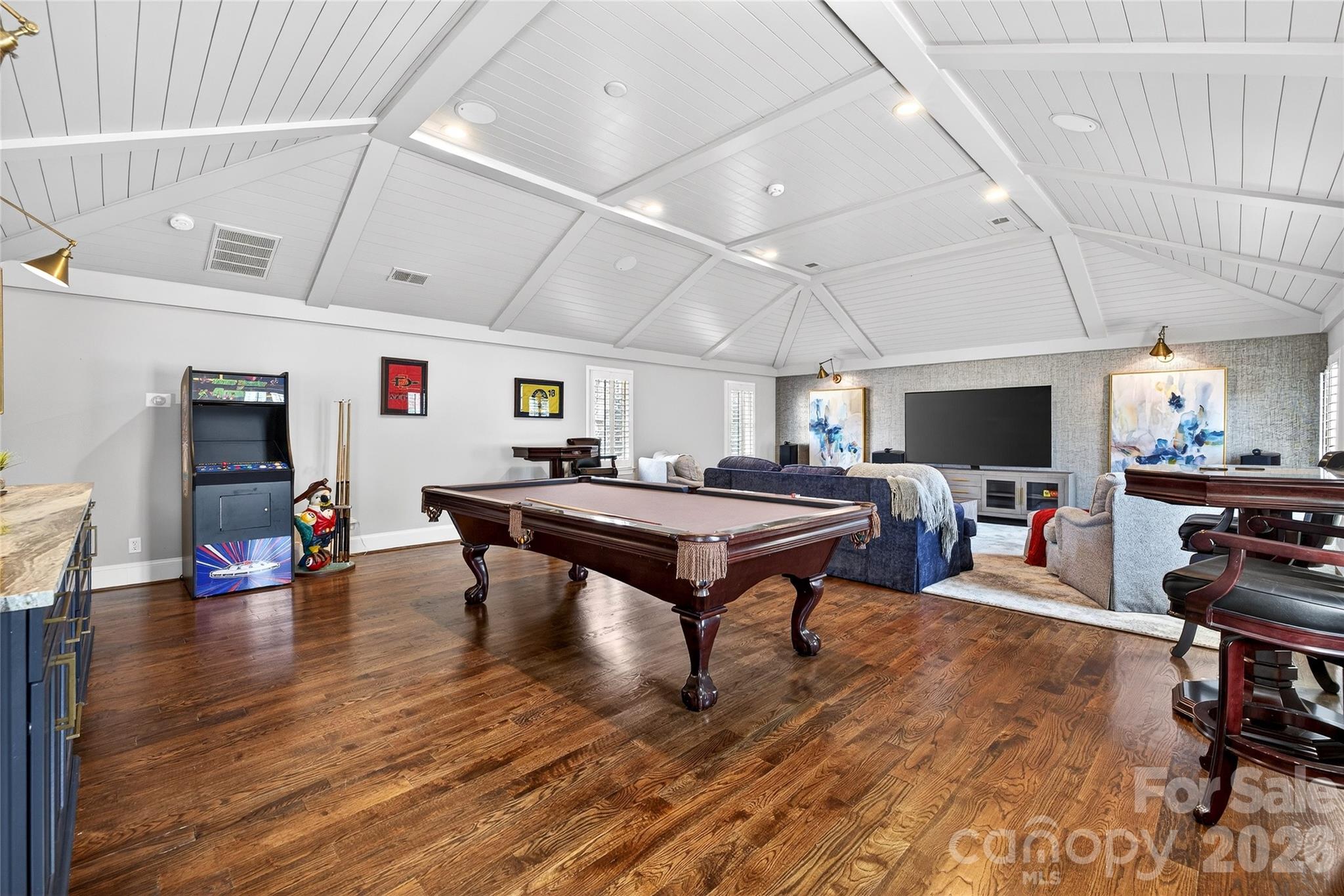 3025 Foxridge Road Charlotte, NC 28226 - Photo 25 of 48 a room with furniture pool table gym equipment wooden floor and a rug