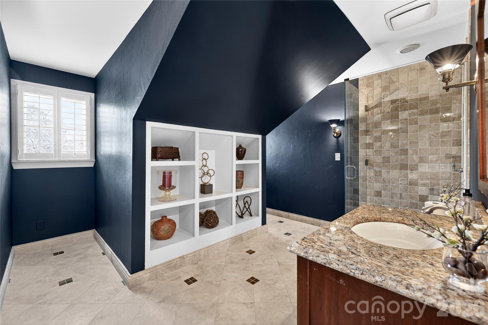 3025 Foxridge Road Charlotte, NC 28226 - Photo 29 of 48 a bathroom with a granite countertop sink and a mirror