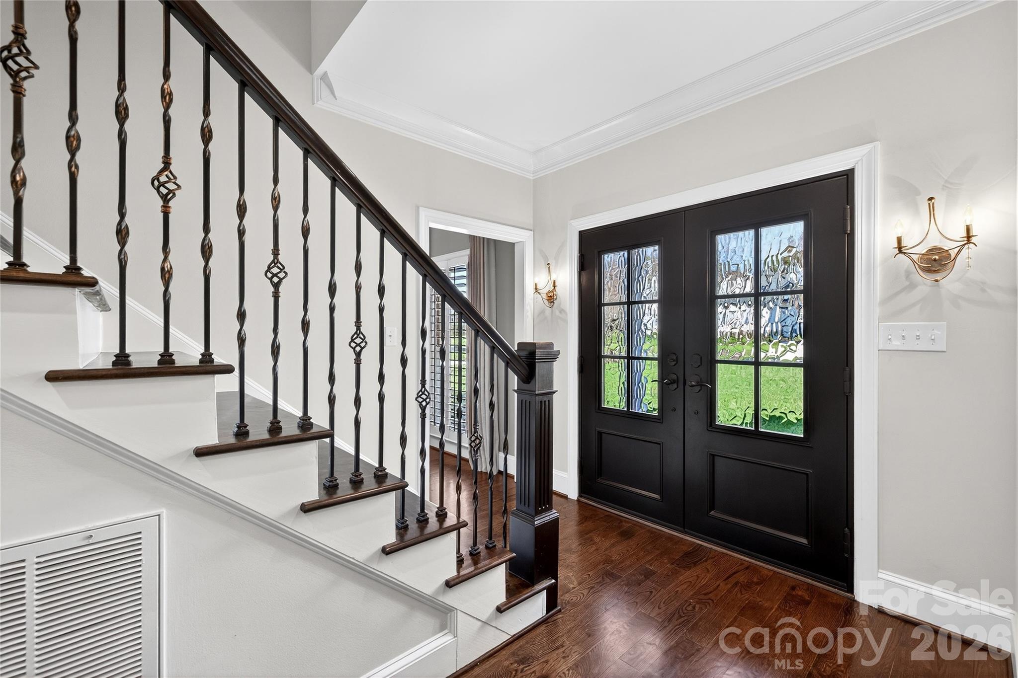 3025 Foxridge Road Charlotte, NC 28226 - Photo 3 of 48 a view of an entryway with wooden floor and door