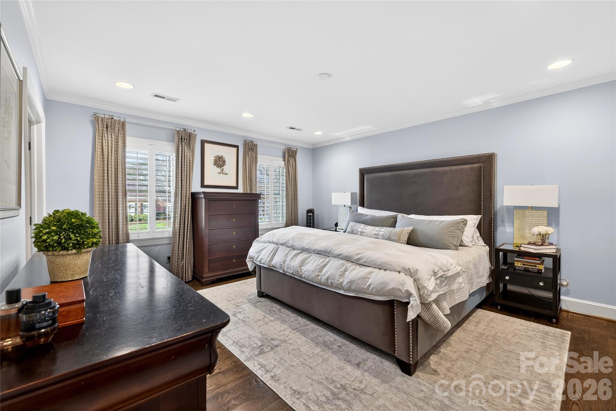 3025 Foxridge Road Charlotte, NC 28226 - Photo 31 of 48 a spacious bedroom with a bed and wooden floor