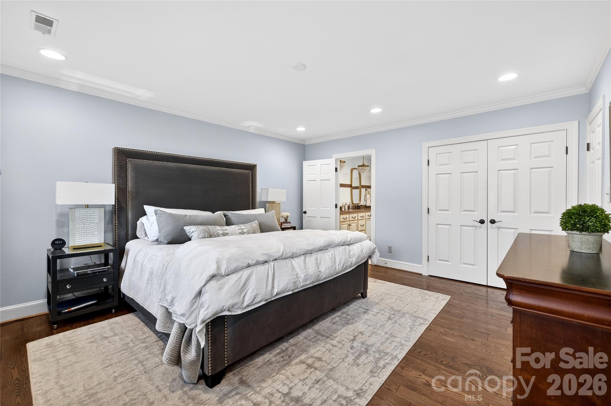 3025 Foxridge Road Charlotte, NC 28226 - Photo 32 of 48 a bedroom with a large bed and a couch