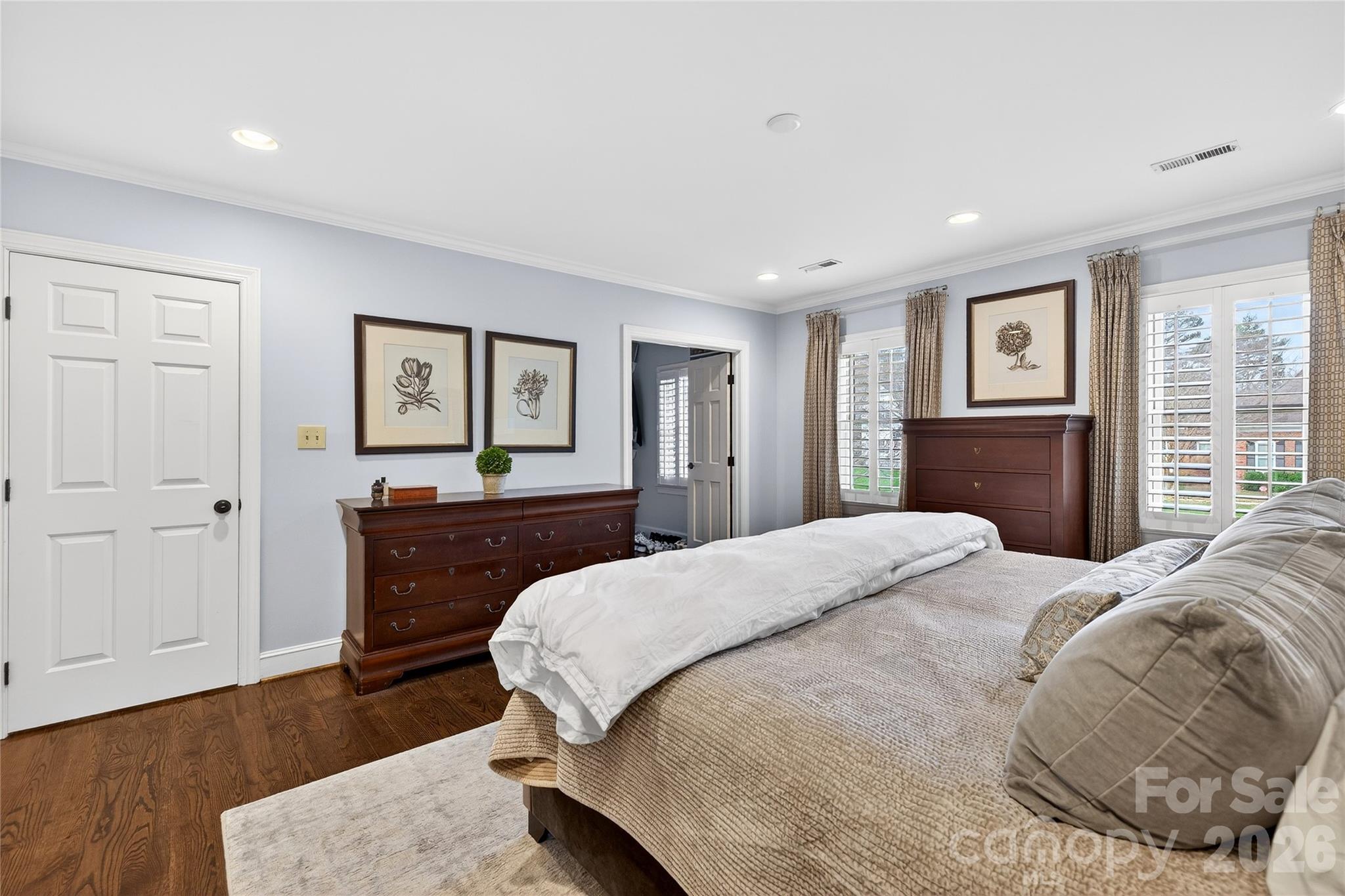 3025 Foxridge Road Charlotte, NC 28226 - Photo 33 of 48 a bedroom with a bed and wooden floor