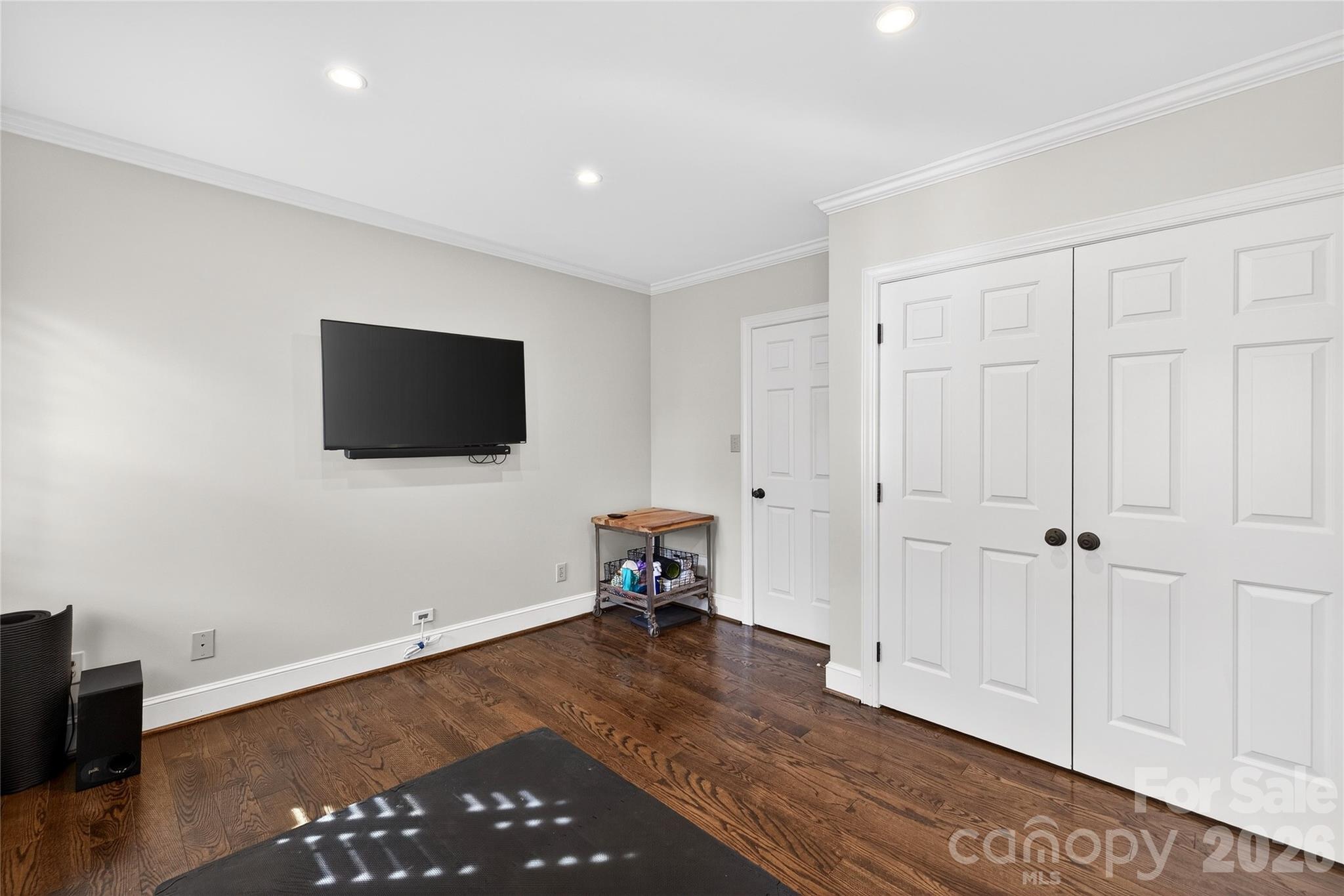 3025 Foxridge Road Charlotte, NC 28226 - Photo 38 of 48 a living room with a flat screen tv and a rug