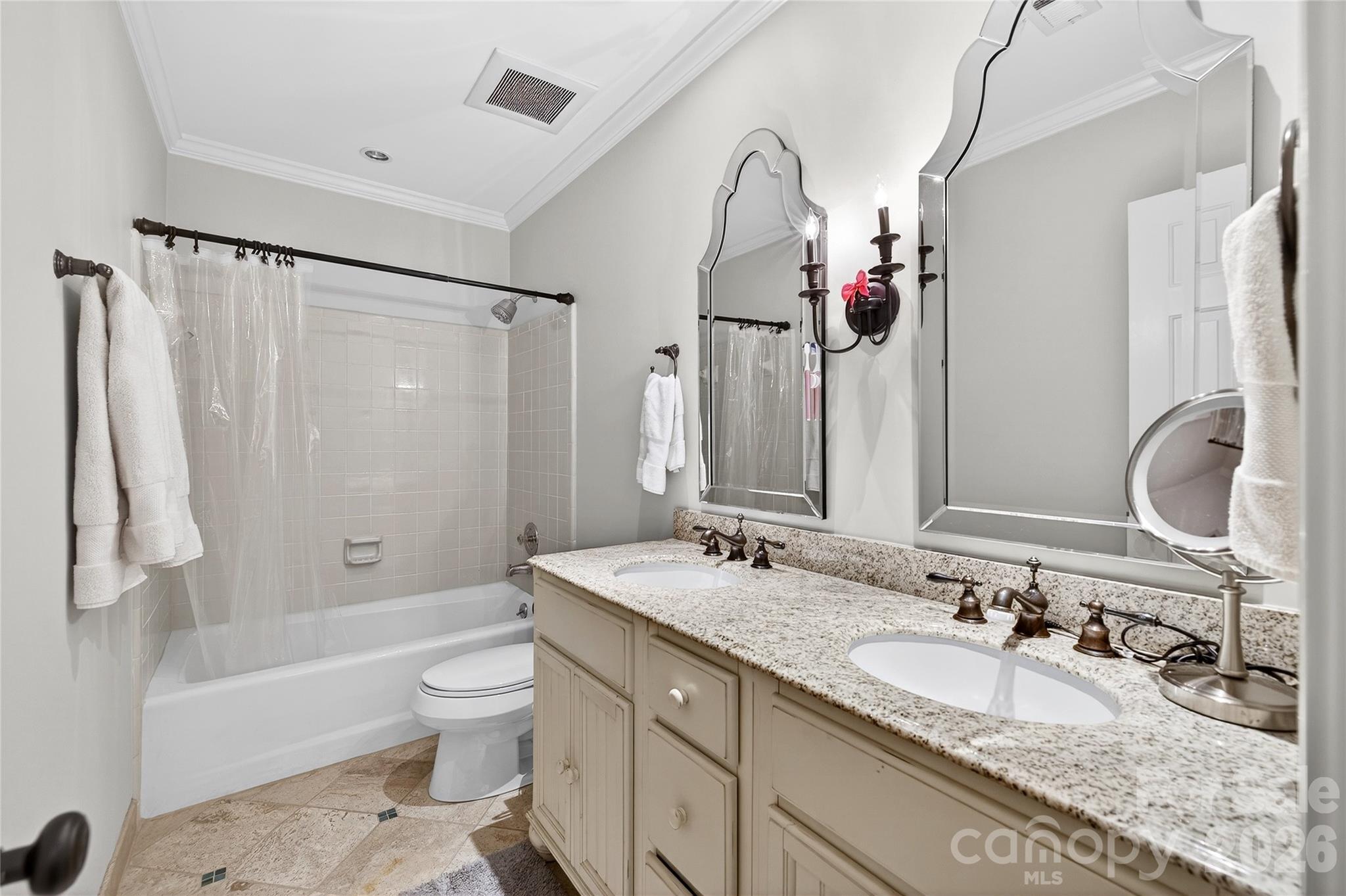 3025 Foxridge Road Charlotte, NC 28226 - Photo 40 of 48 a bathroom with a granite countertop sink toilet and shower