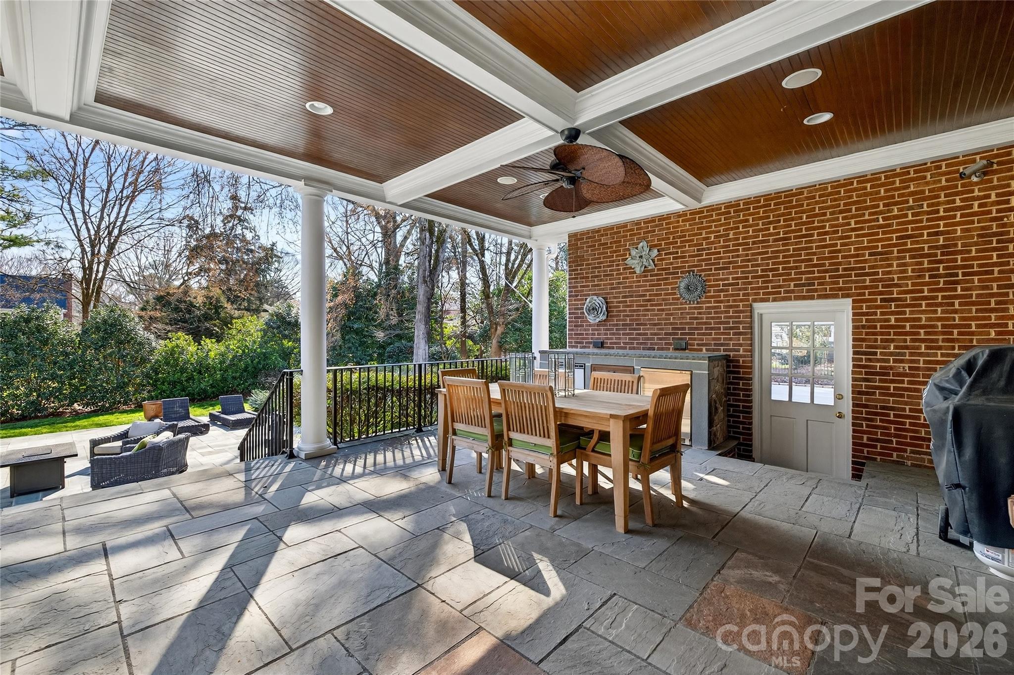 3025 Foxridge Road Charlotte, NC 28226 - Photo 45 of 48 a view of a patio with a dining table and chairs
