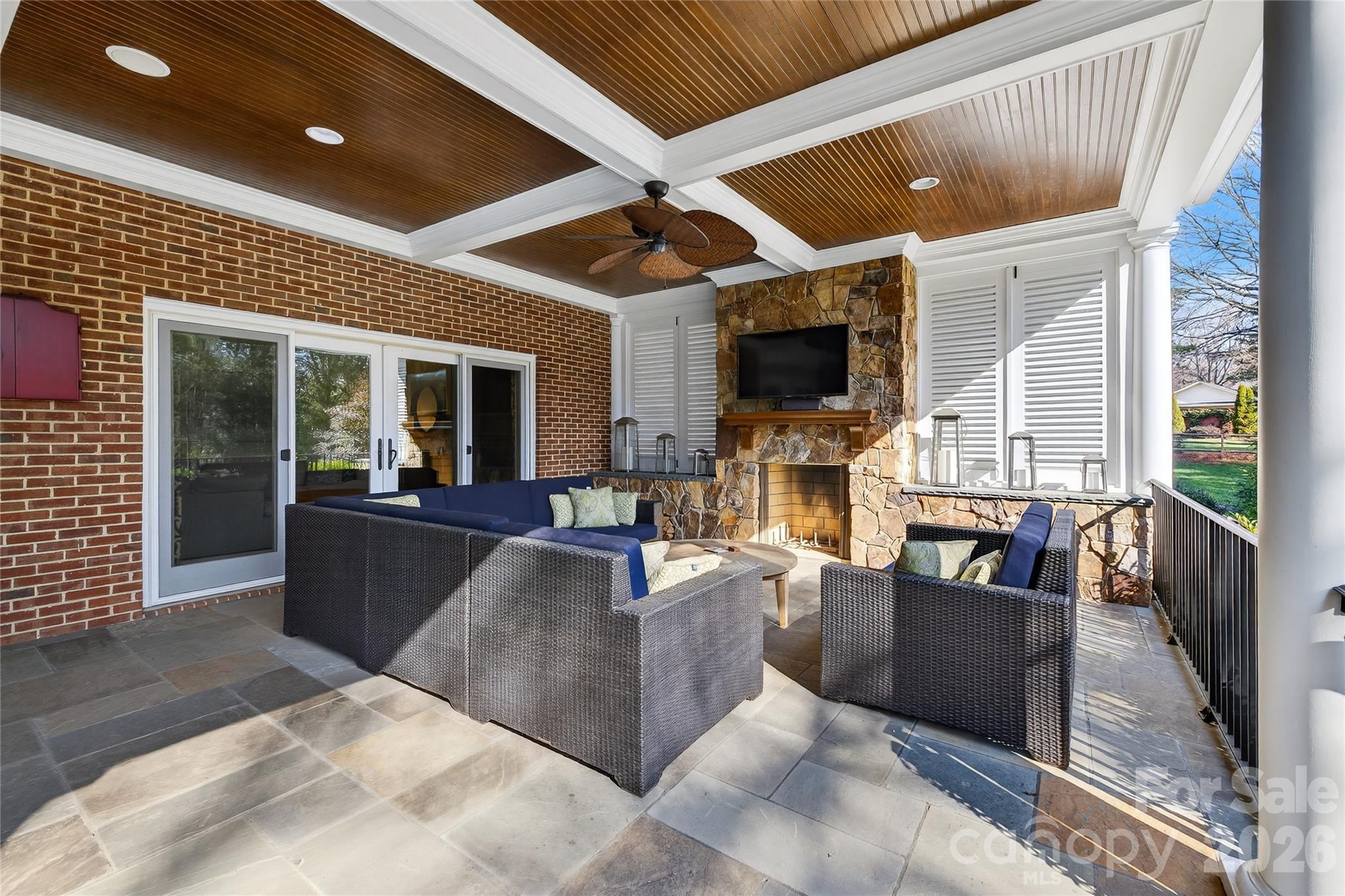 3025 Foxridge Road Charlotte, NC 28226 - Photo 46 of 48 a living room with fireplace furniture and a flat screen tv