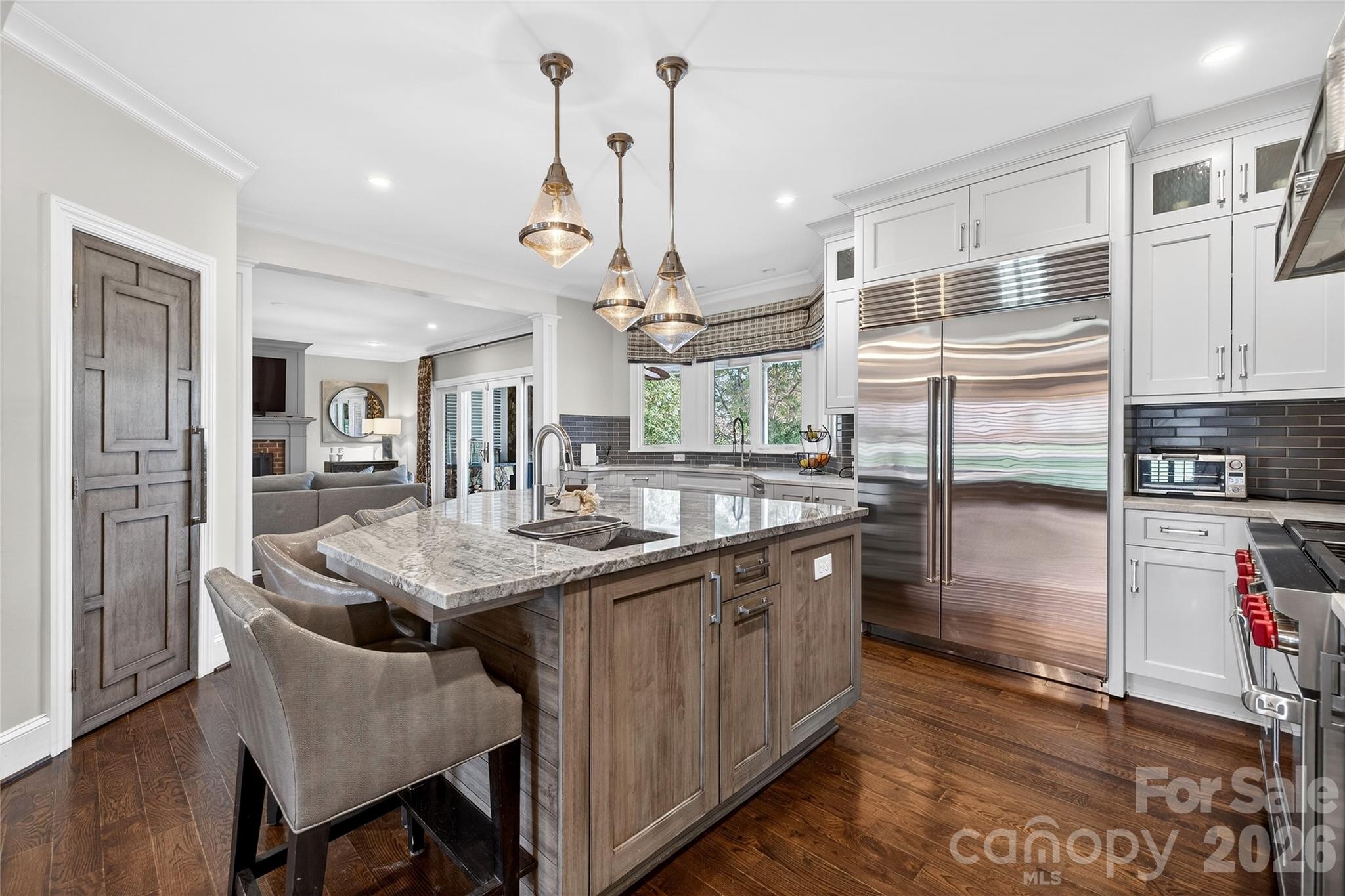 3025 Foxridge Road Charlotte, NC 28226 - Photo 10 of 48 a kitchen with stainless steel appliances granite countertop a sink a stove and a refrigerator