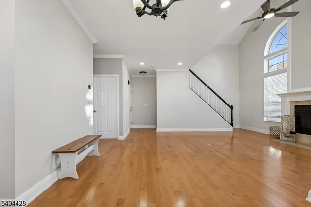 a view of an empty room with a fireplace