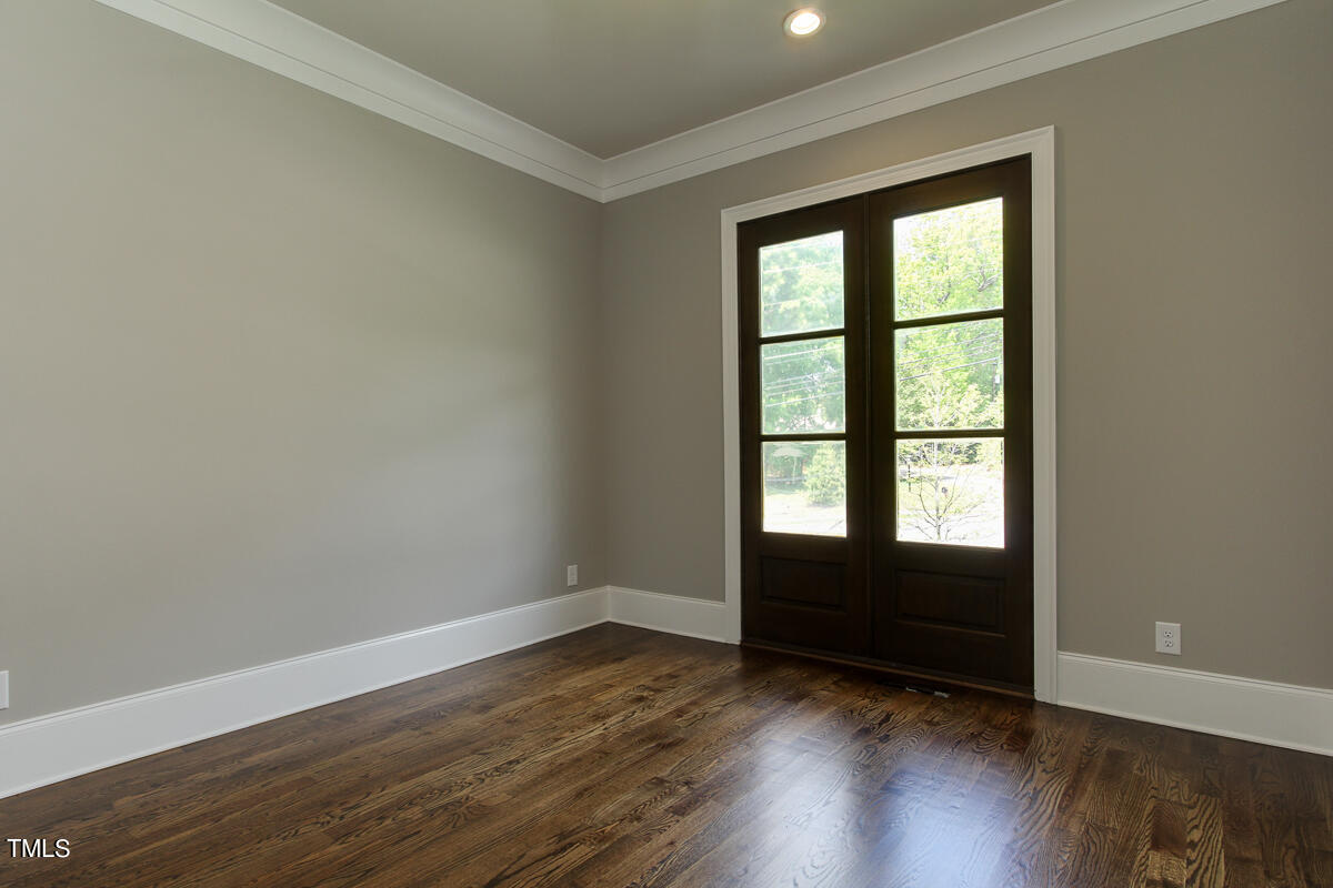 3311 Lake Boone Trail Raleigh, NC 27607 - Photo 11 of 24 wooden floor and window in an empty room
