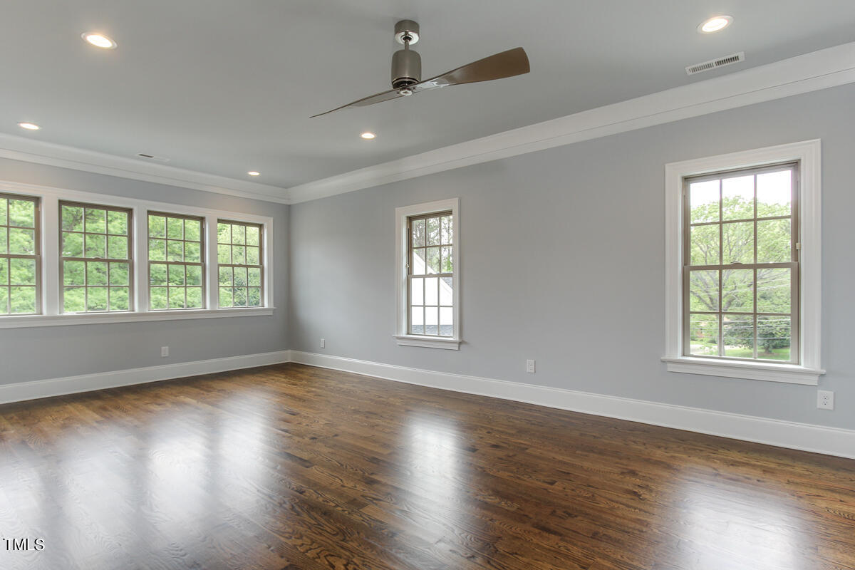 3311 Lake Boone Trail Raleigh, NC 27607 - Photo 13 of 24 a view of an empty room with wooden floor and a window