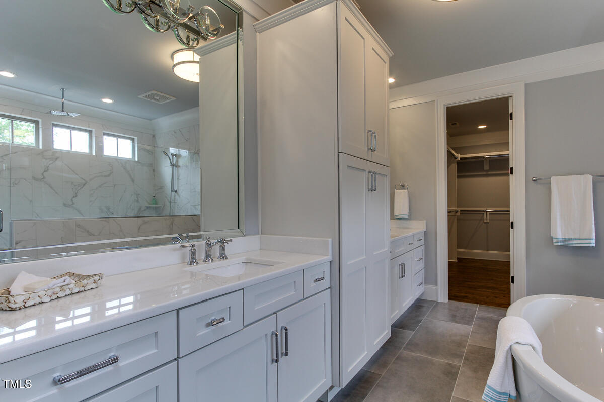 3311 Lake Boone Trail Raleigh, NC 27607 - Photo 15 of 24 a spacious bathroom with a shower sink and mirror
