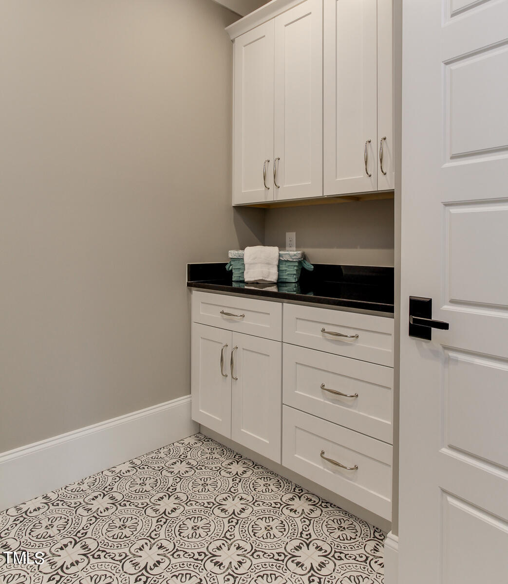 3311 Lake Boone Trail Raleigh, NC 27607 - Photo 17 of 24 a kitchen with white cabinets and white appliances