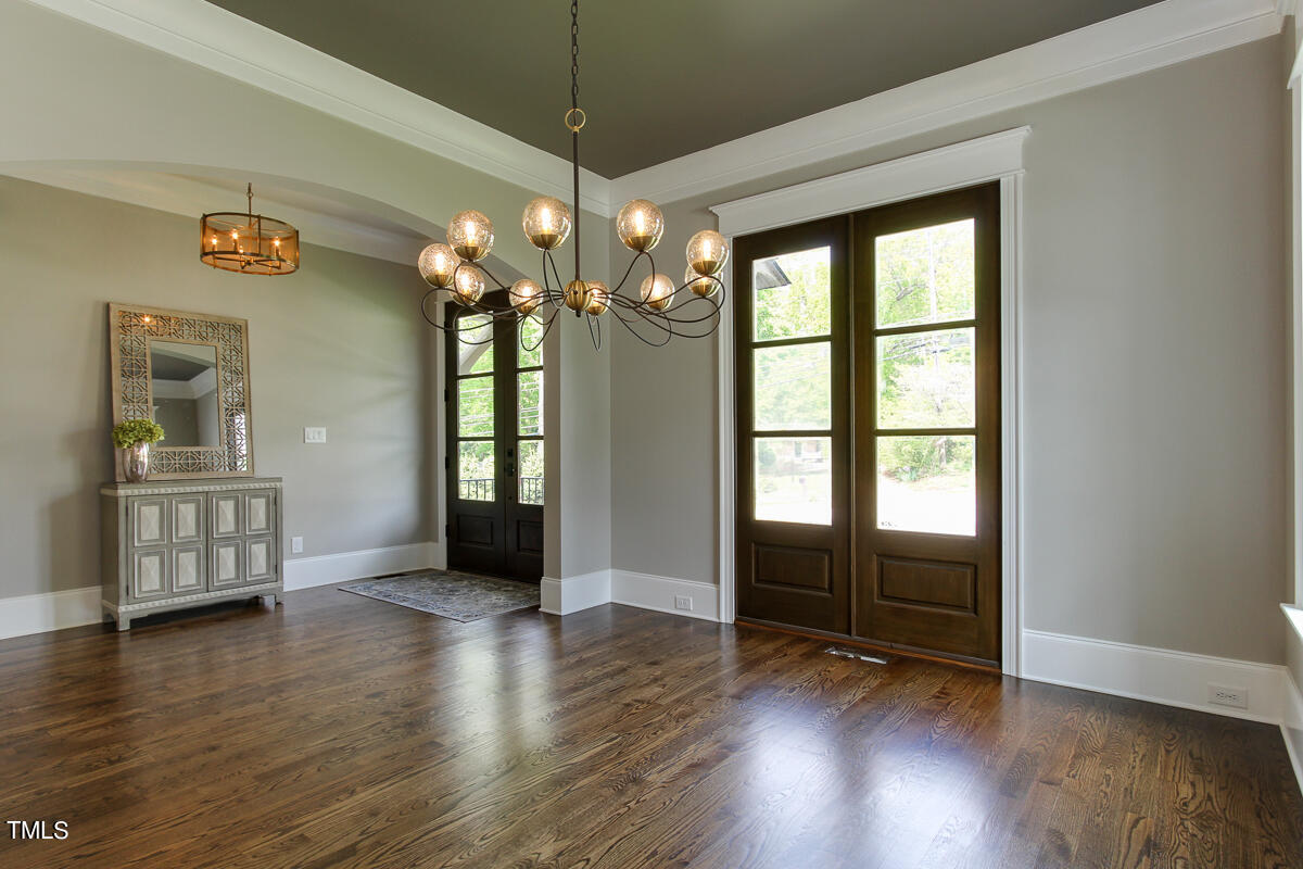 3311 Lake Boone Trail Raleigh, NC 27607 - Photo 2 of 24 wooden floor in an empty room with a window and wooden floor