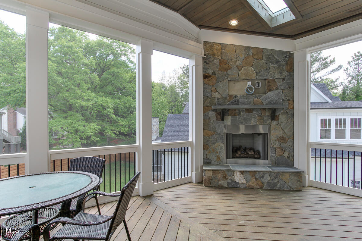 3311 Lake Boone Trail Raleigh, NC 27607 - Photo 24 of 24 a view of a livingroom with furniture wooden floor and a fireplace